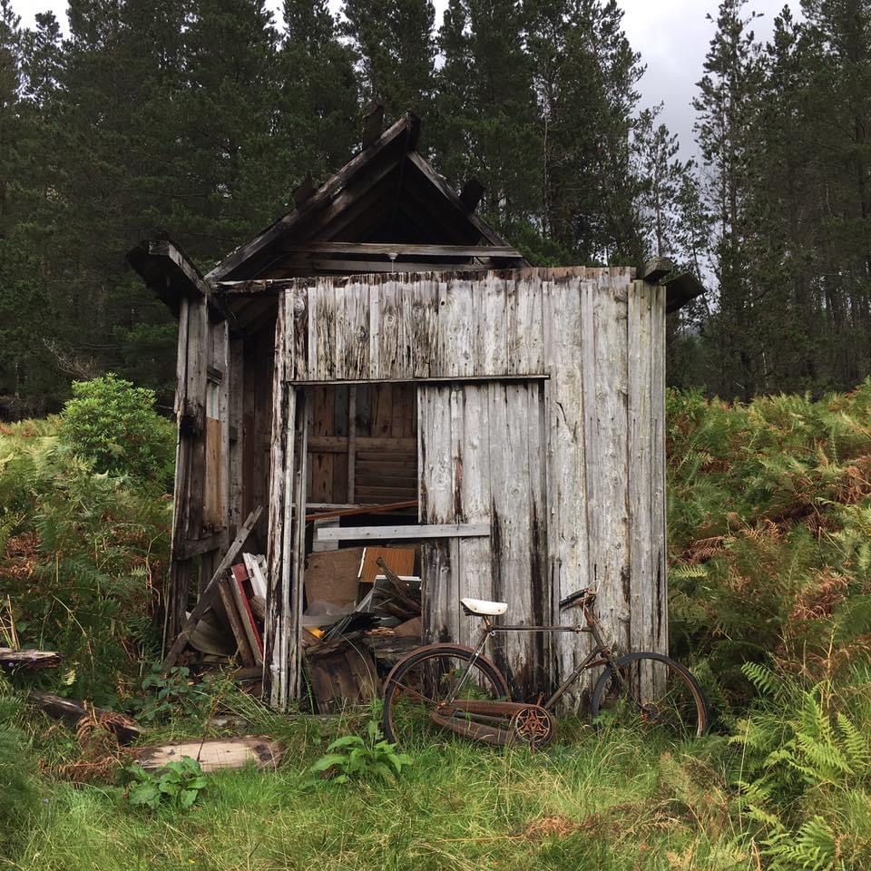 rusty bike against broken shed, Glen Etive